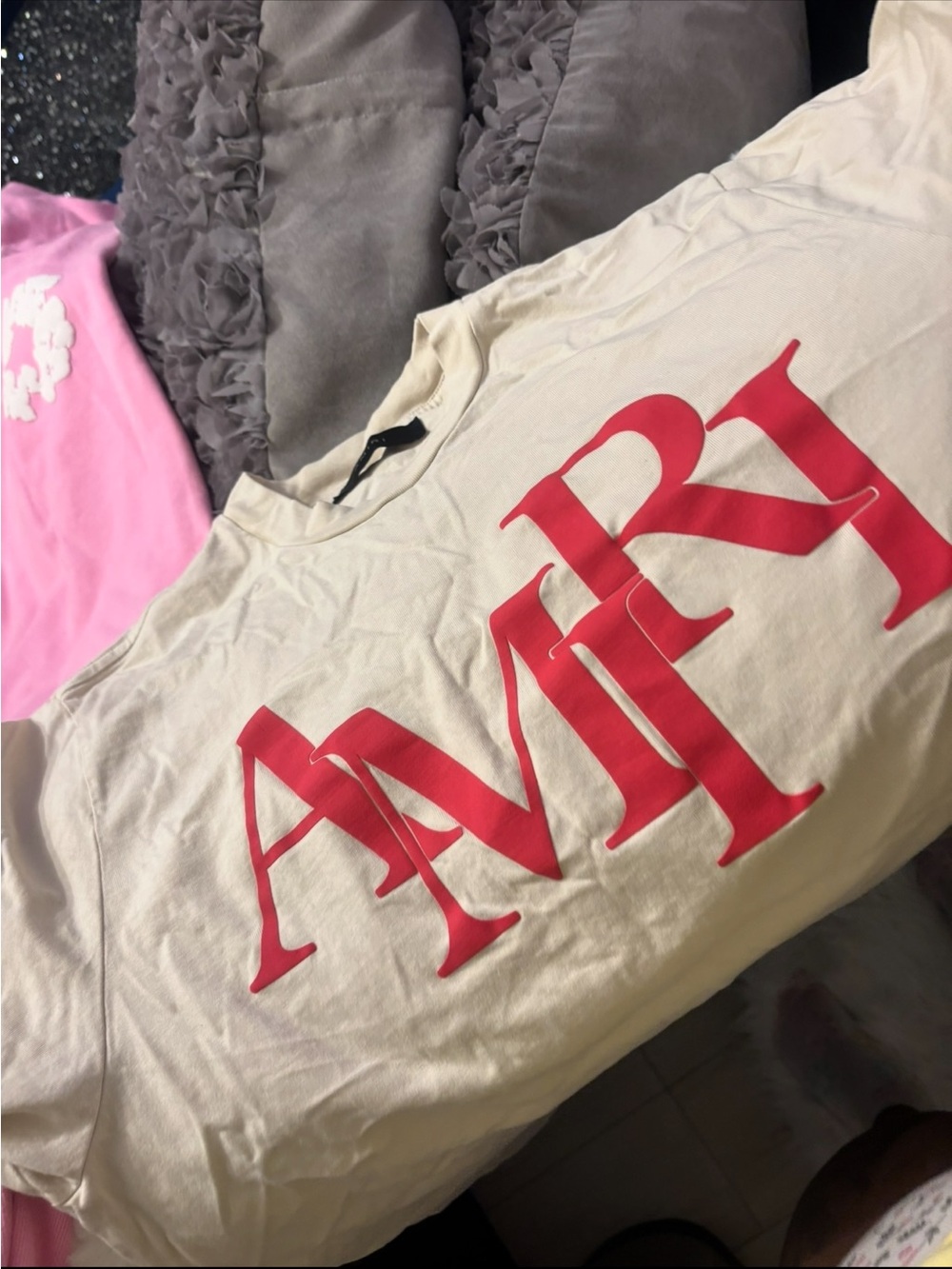 AMIRI Cream Short Sleeve Tee with Bold Red 'AMIRI' Logo